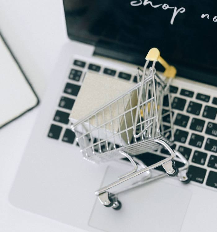 Shopping cart on a laptop keyboard